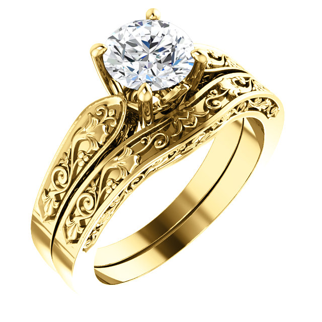 Yellow gold diamond solitaire ring. The ring features a single round diamond in a four-prong setting.