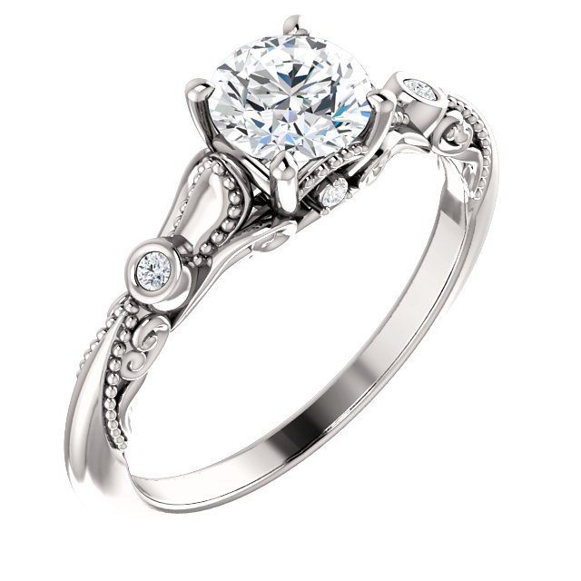 Silver cluster diamond ring. The ring features a round cluster of sparkling diamonds.