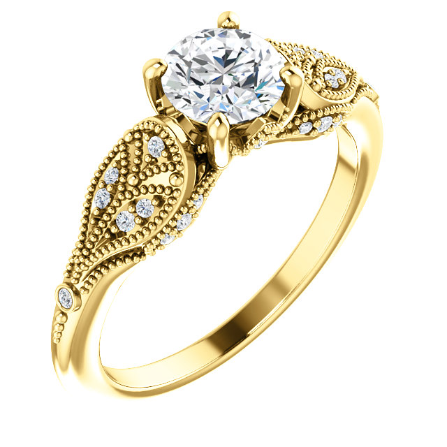 Diamond ring in yellow gold. The center stone is a round diamond, accented by a halo of smaller diamonds.